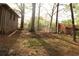 Expansive backyard bordered by trees and a fence, providing ample space for outdoor activities at 1185 Highway 162, Covington, GA 30016