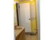 Modest bathroom featuring a toilet and a shower with a tan single sink at 1185 Highway 162, Covington, GA 30016