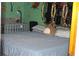 Bedroom with a crib, a bed with a gray blanket, and Lion King wallpaper at 1185 Highway 162, Covington, GA 30016