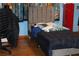 Bedroom features a low bed, light wood floors, and cartoon-themed curtains at 1185 Highway 162, Covington, GA 30016