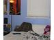 Cozy bedroom features a bed with a patterned blanket and colorful posters at 1185 Highway 162, Covington, GA 30016