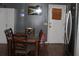 The Dining room with a dark wooden table and chairs next to the stainless steel fridge at 1185 Highway 162, Covington, GA 30016