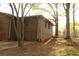 Brick home exterior showing a fenced backyard and a door, blending privacy and practicality at 1185 Highway 162, Covington, GA 30016