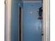 Hallway with pale blue wood paneling and neutral trim, and a Sonic toy hanging on the wall at 1185 Highway 162, Covington, GA 30016