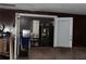 Spacious living room with wooden walls and a view into the kitchen, perfect for entertaining at 1185 Highway 162, Covington, GA 30016