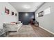 Stylish living room featuring modern decor, gray accent wall, and comfortable seating on wood floors at 245 Piedmont Cir, Covington, GA 30016