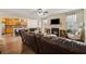 Open living space showcasing a fireplace, TV, eat in kitchen and plenty of natural light throughout the room at 245 Piedmont Cir, Covington, GA 30016