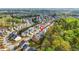Wide aerial view of a suburban neighborhood with tree coverage and well-maintained homes at 3897 Lake Sanctuary Way, Atlanta, GA 30349