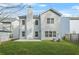 Backyard view highlighting the house, patio, well-maintained lawn, and privacy fence at 3897 Lake Sanctuary Way, Atlanta, GA 30349