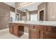 Bathroom featuring double vanity with a large mirror with great lighting and floors at 3897 Lake Sanctuary Way, Atlanta, GA 30349
