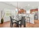 Cozy dining area with modern lighting, adjacent to a functional kitchen space at 3897 Lake Sanctuary Way, Atlanta, GA 30349