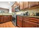 Spacious kitchen features stainless steel appliances and granite countertops at 3897 Lake Sanctuary Way, Atlanta, GA 30349