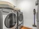 Modern laundry room equipped with a washer and dryer at 3897 Lake Sanctuary Way, Atlanta, GA 30349