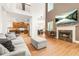 Open-concept living room featuring a fireplace, hardwood floors, and modern decor at 3897 Lake Sanctuary Way, Atlanta, GA 30349