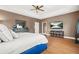 Spacious main bedroom with ample natural light and tray ceilings, and beautiful floors at 3897 Lake Sanctuary Way, Atlanta, GA 30349