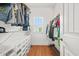 Walk-in closet with customized shelving for ample storage and convenient access at 3897 Lake Sanctuary Way, Atlanta, GA 30349