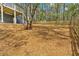 View of the large back yard with wooden fence and stairs to the patio at 4453 Autumn Glo Ct Ct, Douglasville, GA 30135