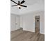 Bright bedroom featuring ceiling fan, neutral paint, and view to the ensuite bathroom at 4453 Autumn Glo Ct Ct, Douglasville, GA 30135