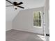 Upstairs bedroom featuring carpet flooring, ceiling fan, and natural light at 4453 Autumn Glo Ct Ct, Douglasville, GA 30135