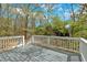 Exterior shot of a gray-stained deck surrounded by trees at 4453 Autumn Glo Ct Ct, Douglasville, GA 30135