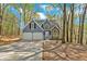 Charming, two-story home with a two-car garage nestled among trees at 4453 Autumn Glo Ct Ct, Douglasville, GA 30135