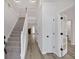 Bright foyer with a staircase and an open view to the living spaces at 4453 Autumn Glo Ct Ct, Douglasville, GA 30135