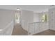 Second story hallway featuring neutral paint, natural light, and carpet flooring at 4453 Autumn Glo Ct Ct, Douglasville, GA 30135