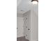 Hallway featuring a closet, doorway, and light fixtures at 4453 Autumn Glo Ct Ct, Douglasville, GA 30135