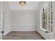 Bright and airy living room with large windows and modern wood flooring at 4453 Autumn Glo Ct Ct, Douglasville, GA 30135