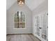 Bright and airy living room with large windows and modern wood flooring at 4453 Autumn Glo Ct Ct, Douglasville, GA 30135