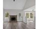 Inviting living room with a fireplace, hardwood floors, and natural light streaming through the windows at 4453 Autumn Glo Ct Ct, Douglasville, GA 30135