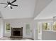 Bright living room with fireplace, hardwood floors, and natural light streaming through the windows at 4453 Autumn Glo Ct Ct, Douglasville, GA 30135