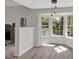 Inviting living room with a bay window, hardwood floors and natural light streaming through the windows at 4453 Autumn Glo Ct Ct, Douglasville, GA 30135