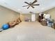 Unfinished basement with two ceiling fans, neutral walls, and plenty of storage space at 7440 Banks Mill Rd, Douglasville, GA 30135