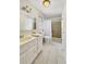 Clean bathroom featuring a white vanity, tile flooring, and a shower-tub combination at 7440 Banks Mill Rd, Douglasville, GA 30135