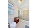 Bathroom features tile floors, a white toilet, and shower with sliding glass doors at 7440 Banks Mill Rd, Douglasville, GA 30135