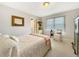 Cozy bedroom with neutral walls, bright window and comfortable furnishings at 7440 Banks Mill Rd, Douglasville, GA 30135