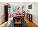 Formal dining room featuring hardwood floors, classic furniture, and elegant chandelier at 7440 Banks Mill Rd, Douglasville, GA 30135