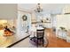 Bright kitchen featuring white cabinets, eat in dining, stone countertops, and stainless steel appliances at 7440 Banks Mill Rd, Douglasville, GA 30135