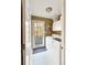 Laundry room with a washer, dryer, cabinets for storage, and access to the outdoor deck at 7440 Banks Mill Rd, Douglasville, GA 30135