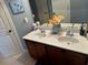 Bathroom with double vanity, neutral walls, framed mirror and closed door at 1210 Del Mar Club Dr, Dacula, GA 30019