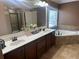 Bathroom with dual sinks, tile floor, soaking tub, and walk-in glass enclosed shower at 1210 Del Mar Club Dr, Dacula, GA 30019