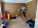 Bonus room with neutral carpeting, natural light, and plenty of space for recreation at 1210 Del Mar Club Dr, Dacula, GA 30019