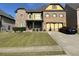 Charming brick home with a well-manicured lawn and two-car garage in suburban neighborhood at 1210 Del Mar Club Dr, Dacula, GA 30019