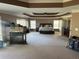 Large carpeted main bedroom with ceiling fan, natural light, and fireplace at 1210 Del Mar Club Dr, Dacula, GA 30019