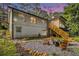 Spacious backyard with fire pit and Adirondack chairs is perfect for entertaining guests at 2810 Dunnington Cir, Chamblee, GA 30341