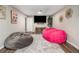 Basement rec room with cozy beanbag chairs and a large TV for entertainment at 2810 Dunnington Cir, Chamblee, GA 30341