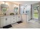 Modern bathroom with a glass-enclosed shower, double vanity, and stylish fixtures at 2810 Dunnington Cir, Chamblee, GA 30341