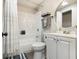 Bathroom featuring a shower-tub combo, sleek vanity, and neutral color scheme at 2810 Dunnington Cir, Chamblee, GA 30341