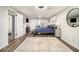 Inviting bedroom features a plush blue comforter, dark wood floors, and bright natural light at 2810 Dunnington Cir, Chamblee, GA 30341